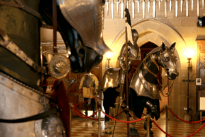 the great hall featuring model horse and knight in armour